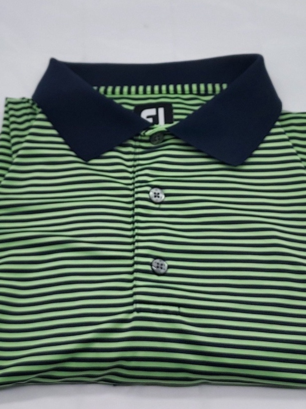FOOTJOY polo golf shirt size Large. Fits like an XL do to the quality